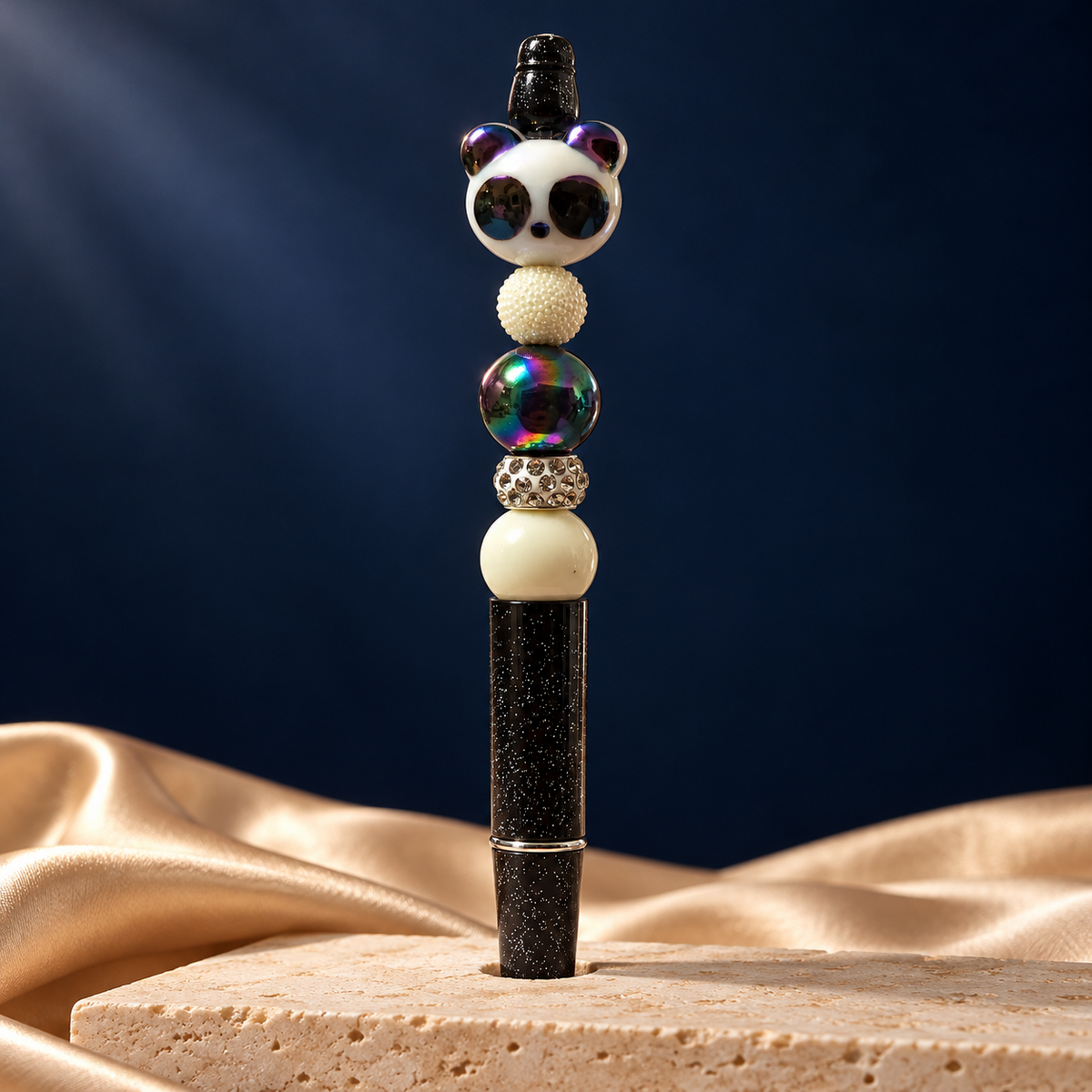 Black glitter-look pen with panda topper, iridescent bead, cream beads, and rhinestone spacer